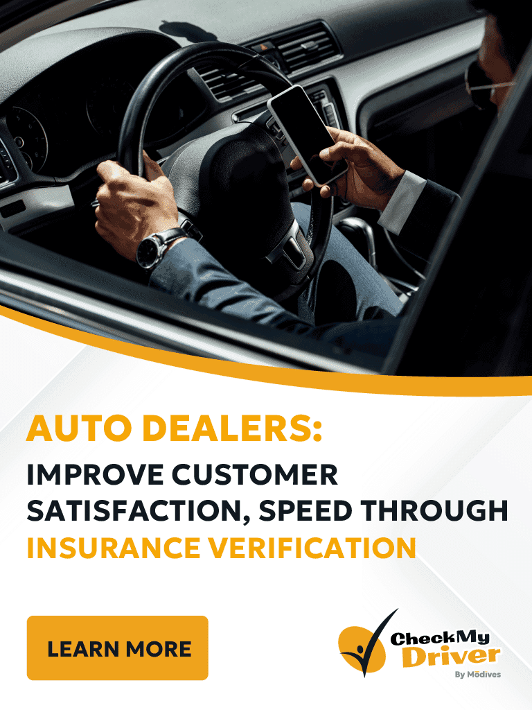 man on steering wheel using his phone