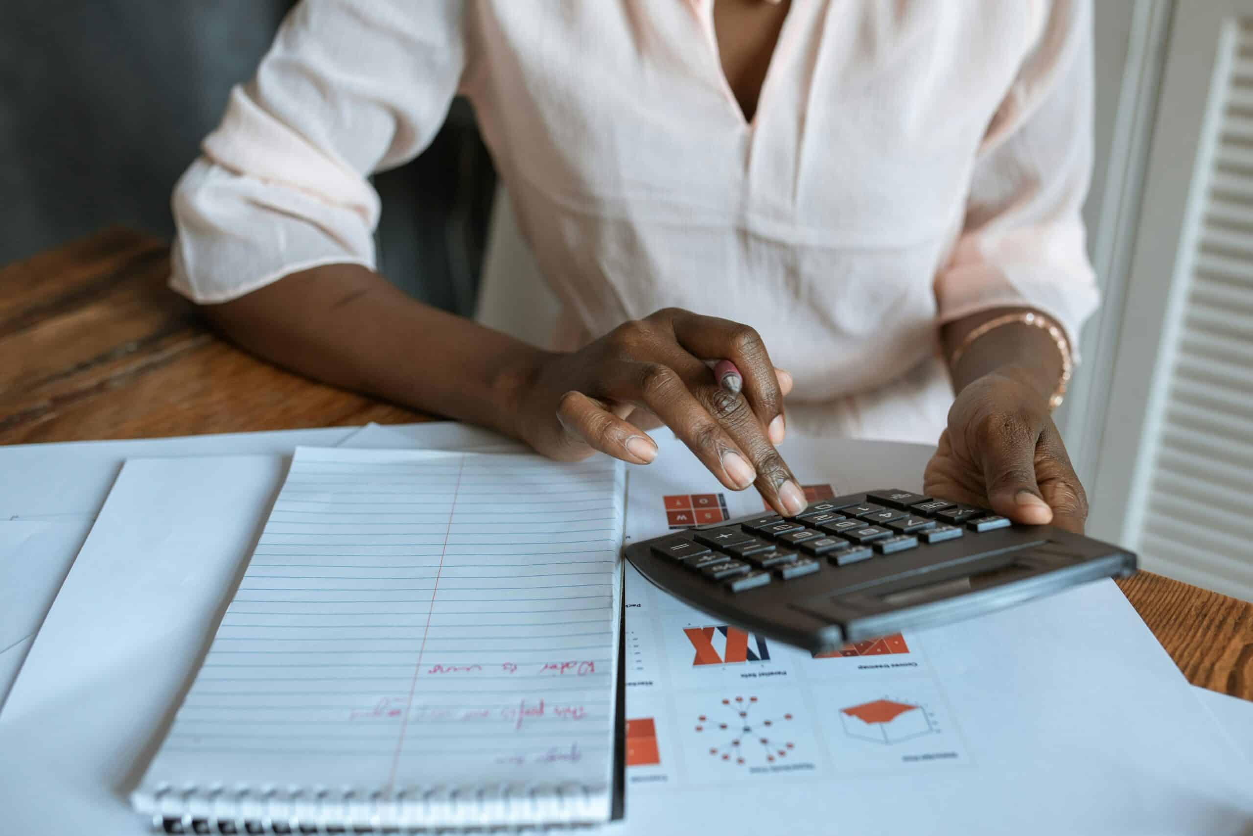 Property manager calculating renters insurance at a desk