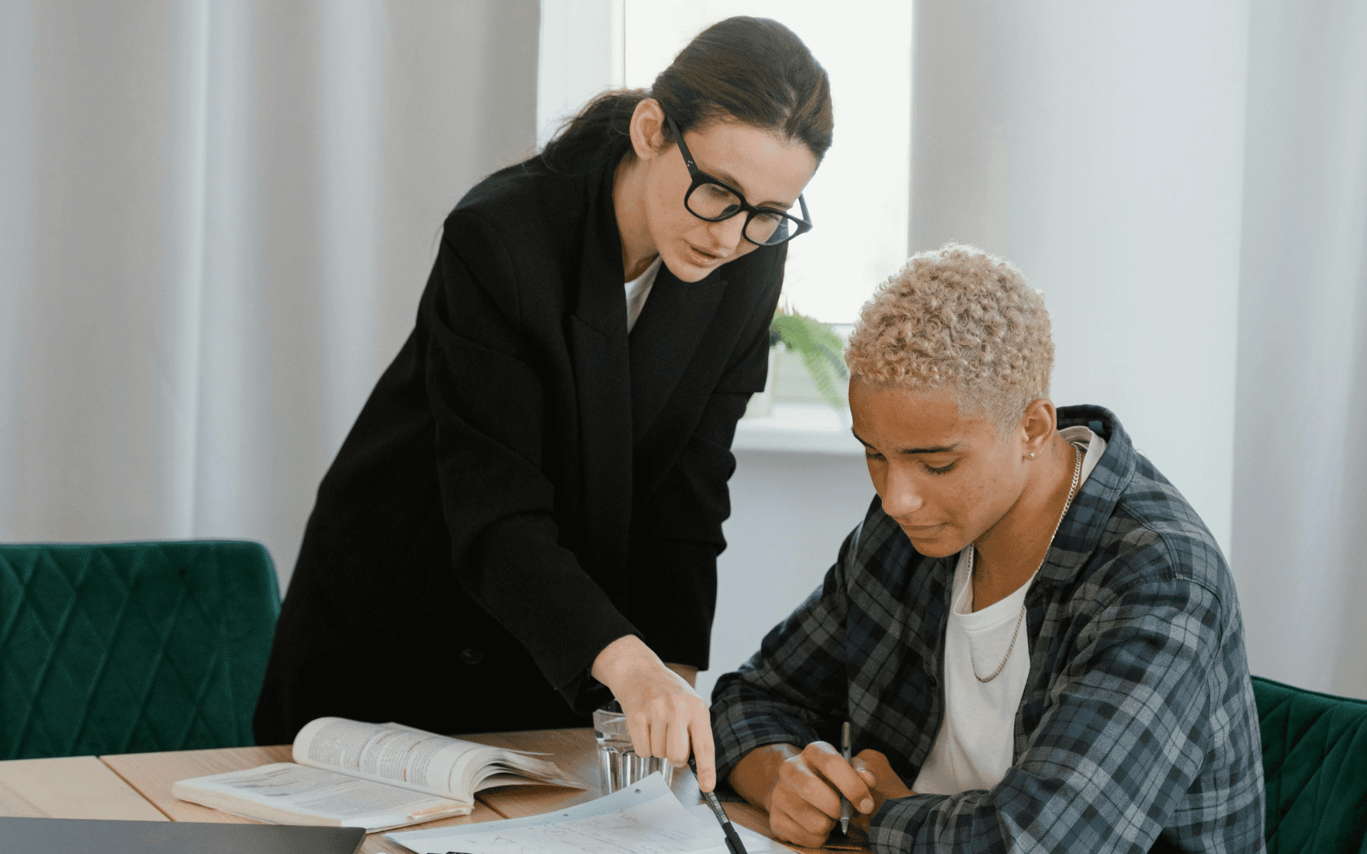 Woman going through papers with a tenant