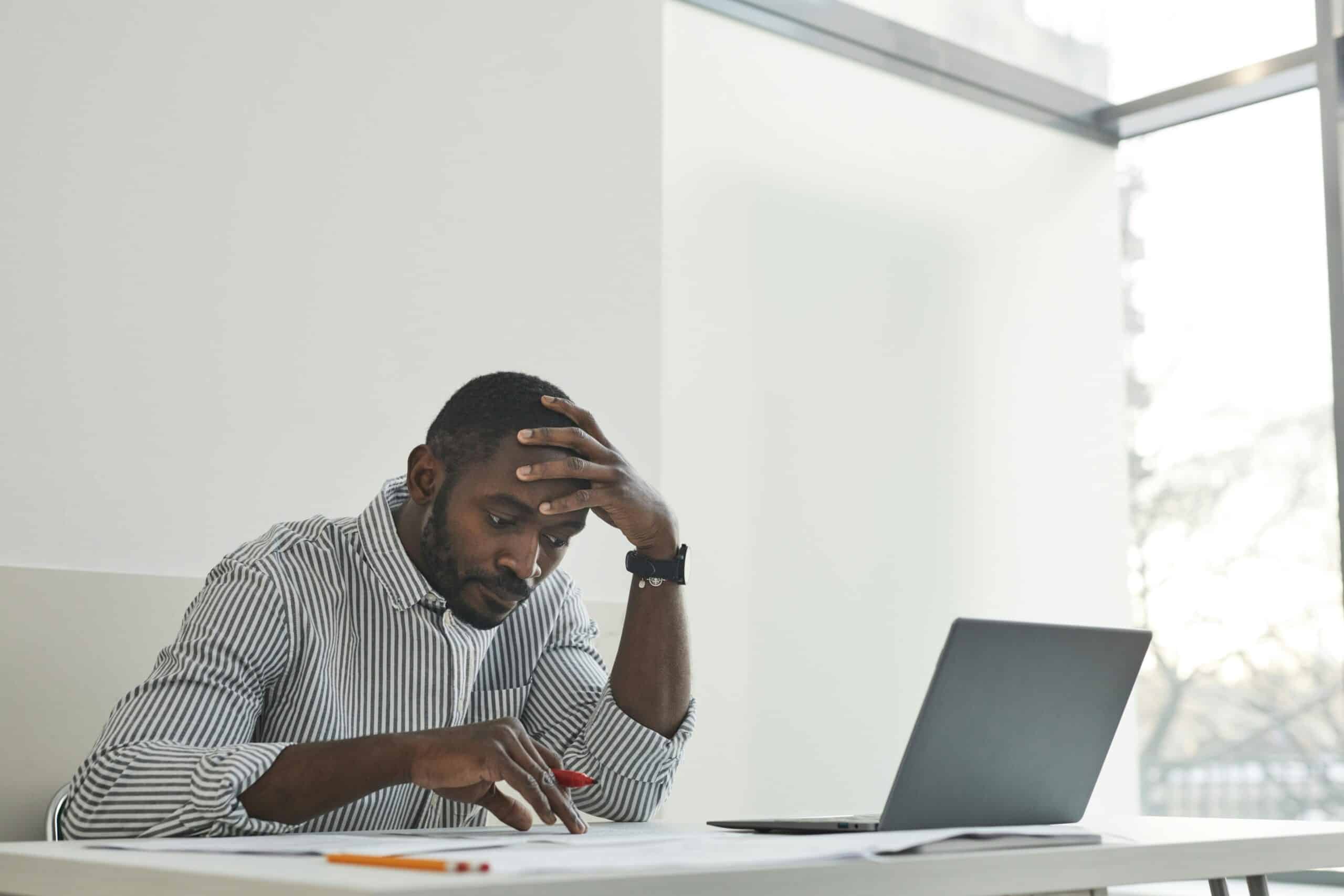 Man working on a project with his laptop in front of him