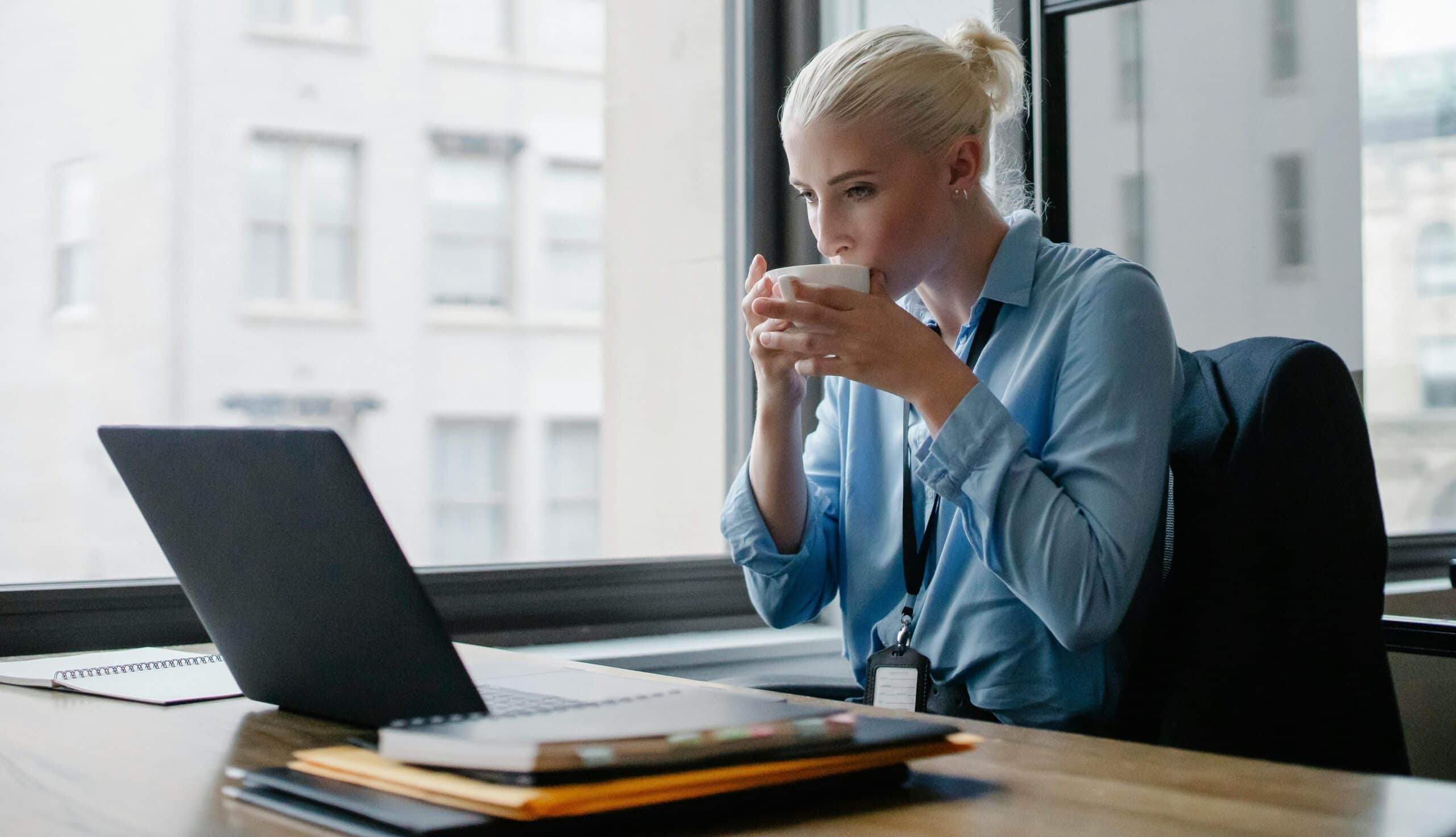 Property manager sitting at a desk in front of a computer