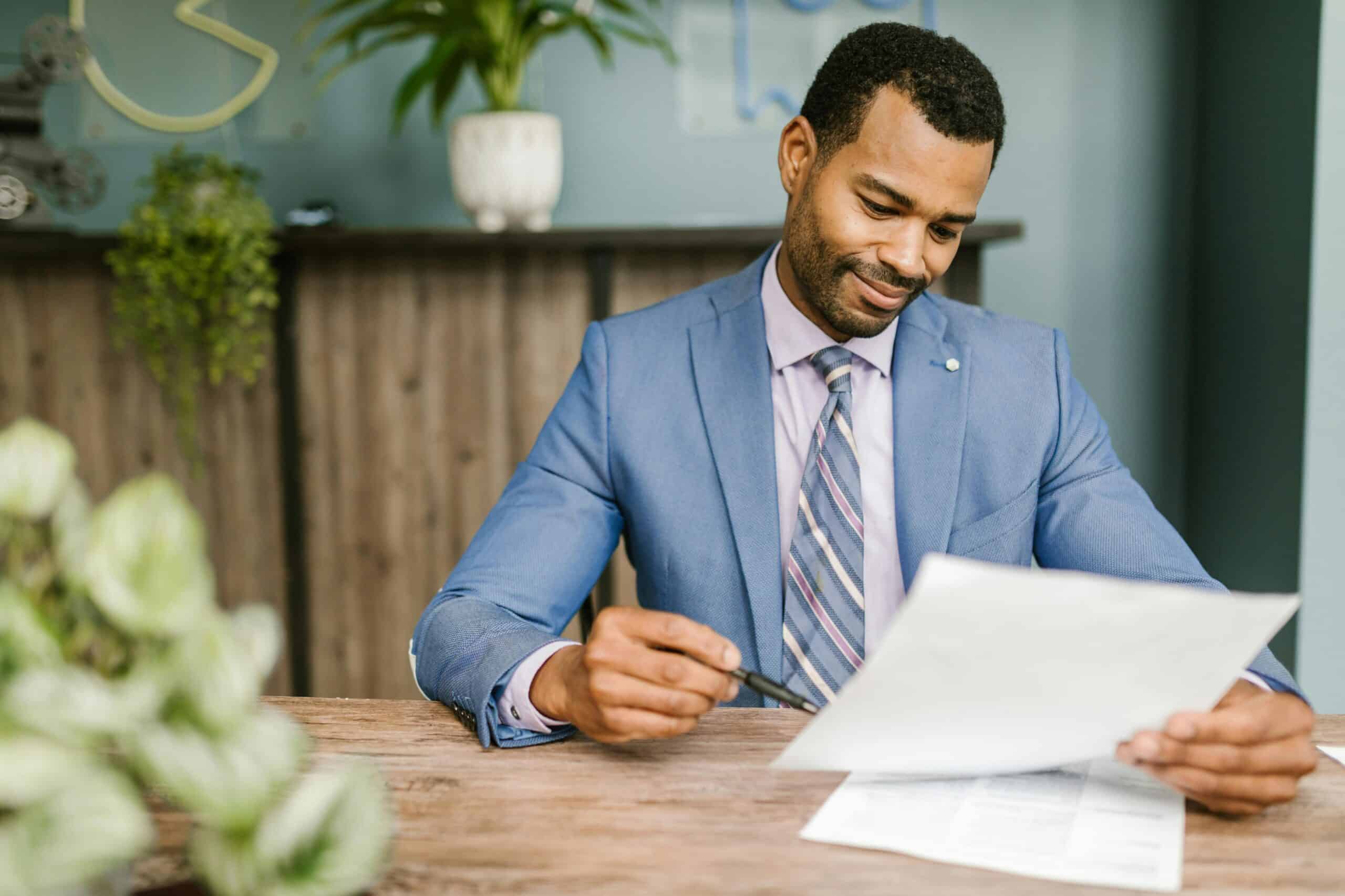 Auto dealer reviewing an insurance doc