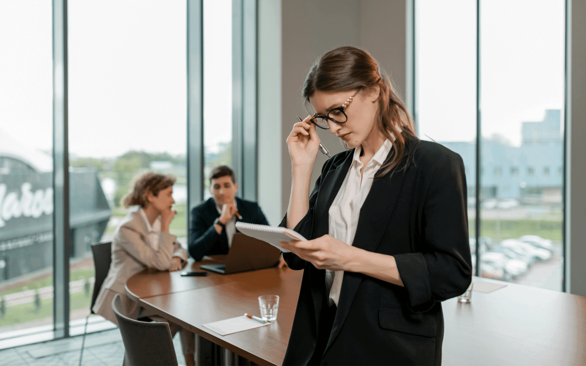 Woman looking at papers in a meeting room