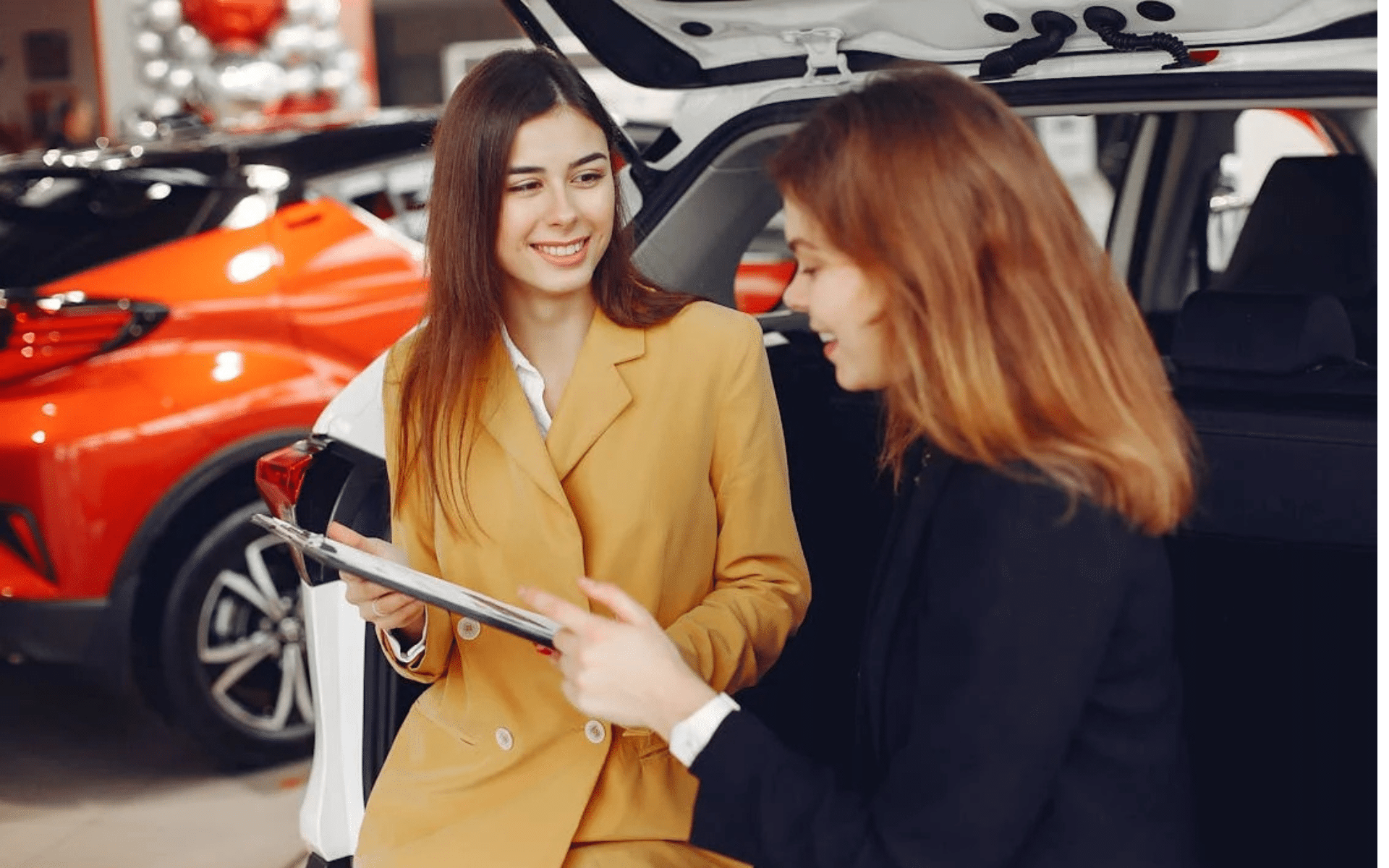 Auto dealer talking to a customer